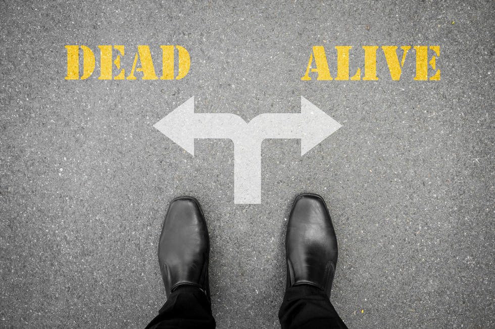 Black shoes standing at the crossroad - dead or alive